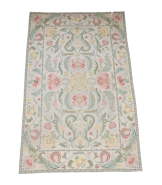 Lot 388 - Portuguese Flatweave Carpet, 2nd half 20th century The cream field of large scrolling floral...