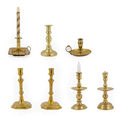 Lot 418 - ~ A Dutch Brass Heemskirk-Type Candlestick, 17th century, with central drip pan, knopped stem...
