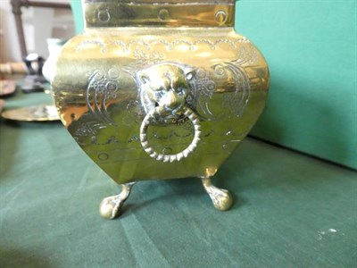Lot 432 - ~ A Dutch Brass Box and Cover, 19th century, of bombé rectangular form with lion mask and ring...