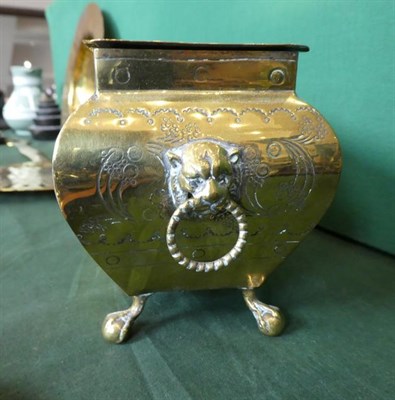 Lot 432 - ~ A Dutch Brass Box and Cover, 19th century, of bombé rectangular form with lion mask and ring...