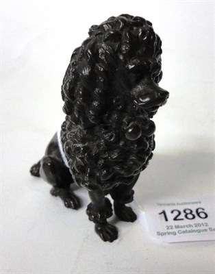 Lot 1286 - A French Bronze Figure of a Poodle, late 19th century, sitting on its haunches, 8cm high