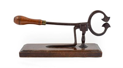 Lot 449 - ~ A Pair of Georgian Steel Sugar Cutters, with demi-lune blades and turned baluster handle on a...
