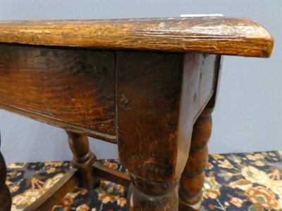 Lot 452 - ~ A Late 17th Century Oak Joint Stool, of peg and nail construction, the moulded top above a...