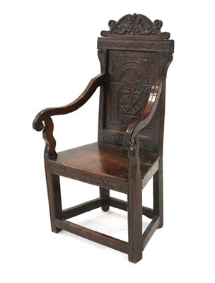 Lot 454 - ~ A Good 17th Century Joined Oak Wainscot Armchair, with scrolled top rail above a lunette...