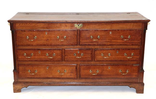 Lot 458 - A George III Lancashire Oak and Mahogany Crossbanded Mule Chest, the hinged lid above two dummy...