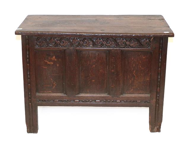 Lot 465 - An Early 18th Century Joined Oak Chest, the hinged lid enclosing a vacant interior above a scrolled