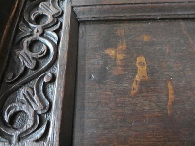 Lot 465 - An Early 18th Century Joined Oak Chest, the hinged lid enclosing a vacant interior above a scrolled