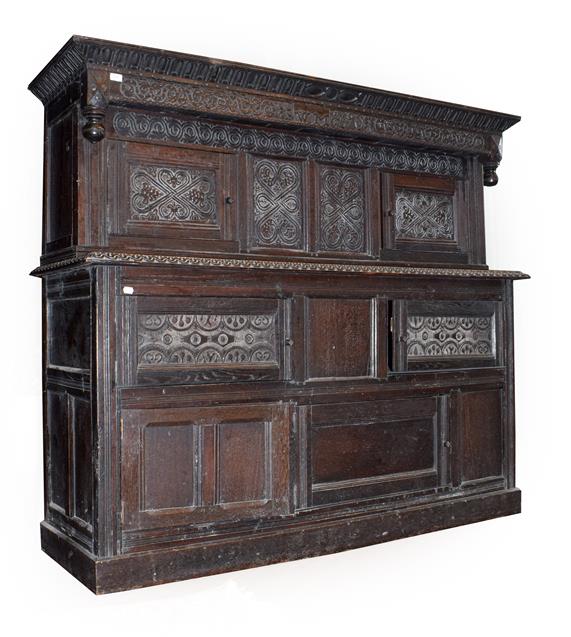 Lot 469 - A Carved Oak Press Cupboard, bearing the date and initials 1690 WM, the moulded and nulled...