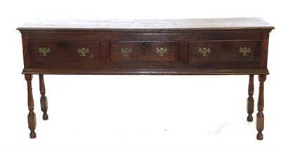 Lot 473 - An Early 18th Century Oak Dresser Base, the moulded top above three frieze drawers and moulded...