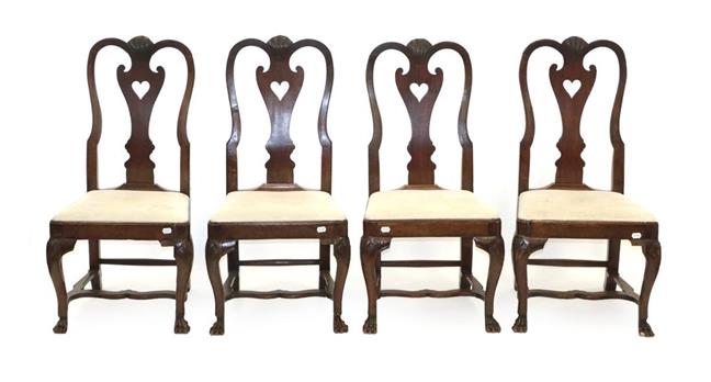 Lot 474 - A Set of Four Early 18th Century Joined Oak High-Back Dining Chairs, the shell carved top rails...