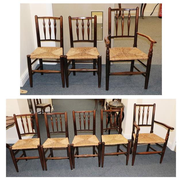 Lot 482 - A Set of Eight Mid 19th Century Rush-Seated Ash Chairs, including two carvers, with turned...