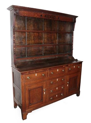 Lot 487 - A George III Oak and Mahogany Crossbanded Dresser, Wales Region, early 19th century, the rack...