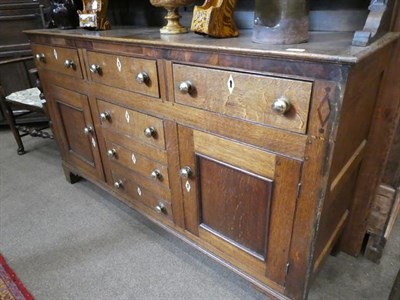 Lot 487 - A George III Oak and Mahogany Crossbanded Dresser, Wales Region, early 19th century, the rack...