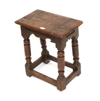 Lot 488 - A Late 17th Century Oak Joint Stool, the pegged top above a moulded frieze and scrolled apron,...