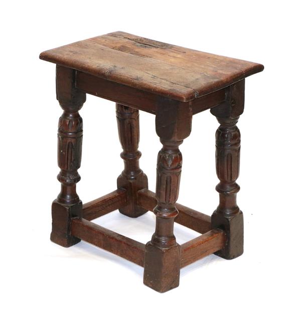 Lot 489 - A Late 17th Century Oak Joint Stool, the nailed top above a plain frieze, on turned and carved...