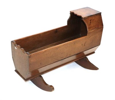 Lot 495 - An Oak Cradle on Rockers, 2nd quarter 19th century, with canopy hood, of boarded and nailed...