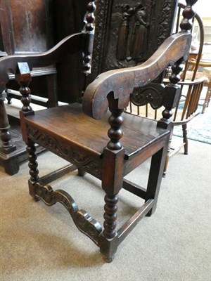 Lot 496 - A Victorian Joined Oak Armchair, mid 19th century, the carved top rail above a relief carved...