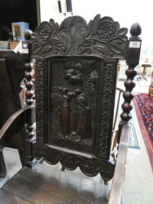 Lot 496 - A Victorian Joined Oak Armchair, mid 19th century, the carved top rail above a relief carved...