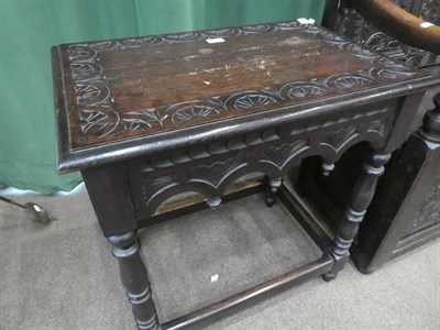 Lot 497 - A Victorian Carved Oak Hall Table, late 19th century, the rectangular top with lunette carved...