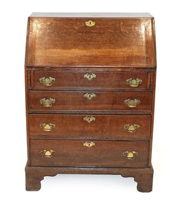 Lot 500 - A George II Oak Bureau, 2nd quarter 18th century, the fall enclosing a later fitted interior...
