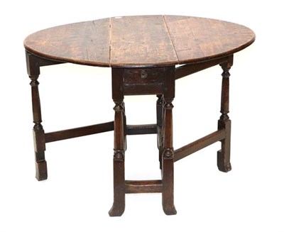 Lot 501 - An Early 18th Century Oak Dropleaf Table, with single drawer, on turned legs and two gatelegs...