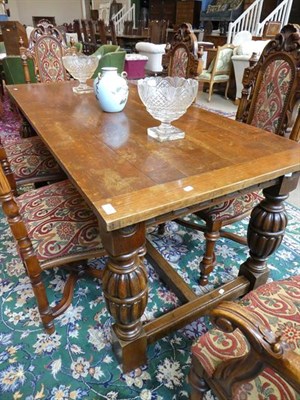 Lot 504 - An Oak Refectory Style Dining Table, late 19th/early 20th century, of plank construction with...