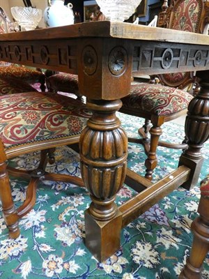 Lot 504 - An Oak Refectory Style Dining Table, late 19th/early 20th century, of plank construction with...