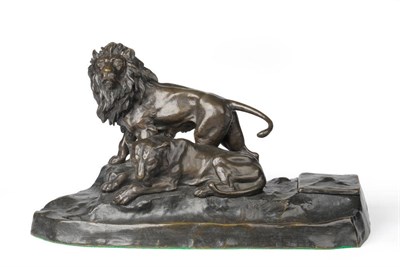 Lot 1293 - A Bronze Desk Stand, late 19th/early 20th century, as a standing lion and recumbent lioness, on...