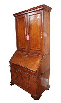 Lot 514 - An Early 18th Century Walnut Bureau Bookcase, the upper section with moulded panel doors...