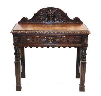 Lot 520 - A Victorian Carved Oak Hall Table, circa 1880, the scrolled pediment carved in relief above a...