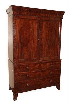 Lot 529 - A George IV Mahogany Linen Press, 2nd quarter 19th century, the inverted breakfront moulded cornice