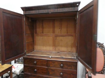Lot 529 - A George IV Mahogany Linen Press, 2nd quarter 19th century, the inverted breakfront moulded cornice