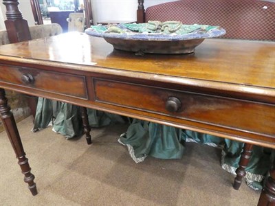 Lot 537 - A Victorian Mahogany Writing Table, mid 19th century, of rectangular form with two moulded drawers