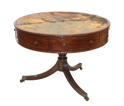 Lot 544 - A Rare George III Mahogany Drum Table, circa 1800, with worn green leather writing surface and...