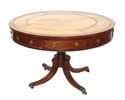 Lot 546 - A Late George III Mahogany Drum Table, early 19th century, with later brown and gilt tooled leather