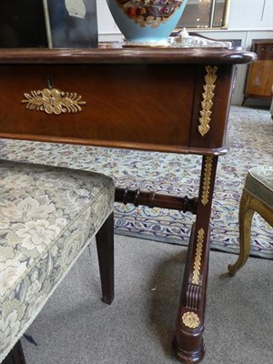 Lot 565 - A Late 19th Century Mahogany and Gilt Metal Mounted Writing Table, in Empire style, the moulded top