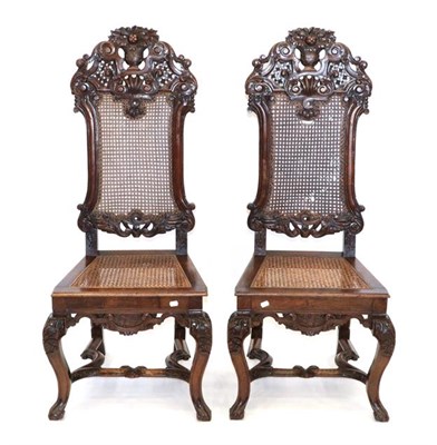 Lot 566 - A Pair of William & Mary Style Carved Walnut Side Chairs, in the style of Daniel Marot, with...