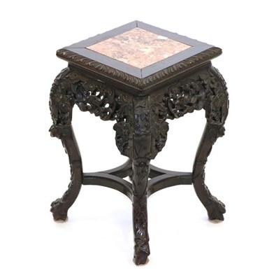 Lot 567 - An Early 20th Century Chinese Carved Hardwood Plant Stand, with pink marble top within a leaf...