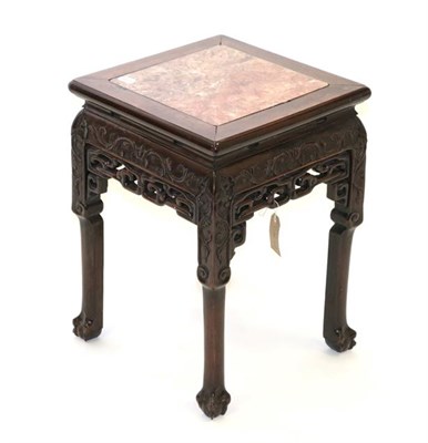 Lot 568 - A Chinese Carved Padouk Wood and Pink Marble Plant Stand, late 19th/early 20th century, the foliate