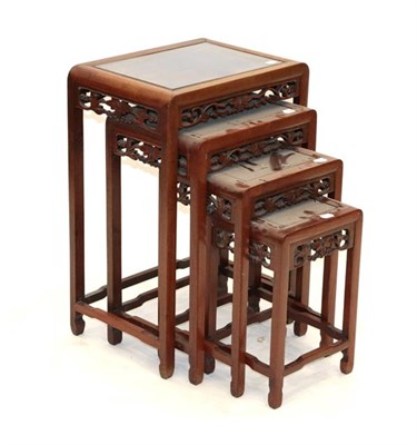 Lot 569 - A Set of Four Early 20th Century Chinese Hardwood Nesting Tables, of rectangular moulded form,...