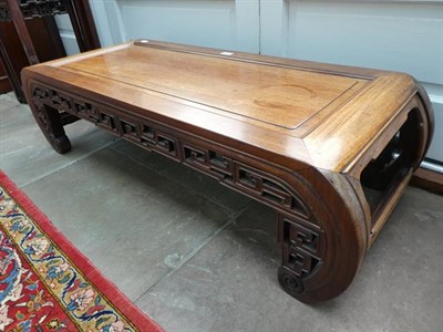 Lot 571 - An Early 20th Century Chinese Hardwood Kang Style Table, on scrolled horseshoe feet joined by a...