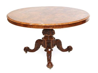 Lot 580 - A Victorian Burr Walnut Circular Dining Table, circa 1870, the base numbered 3925, the moulded...