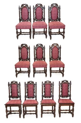 Lot 583 - Ten Victorian Carved Oak Dining Chairs, circa 1880, recovered in pink floral fabric, comprising six