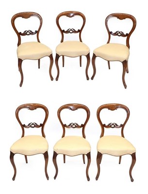 Lot 585 - A Set of Six Victorian Walnut Balloon-Back Dining Chairs, circa 1870, recovered in cream and...