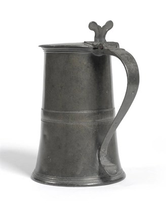 Lot 1305 - An English Pewter Flagon, early 18th century, the flat hinged cover with reeded rim and...