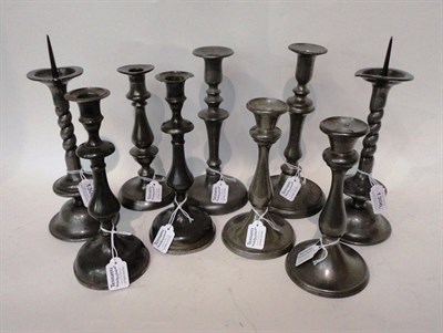 Lot 1306 - Nine Victorian Pewter Candlesticks, 19th century, two of an earlier pricket form, 21-30cm high