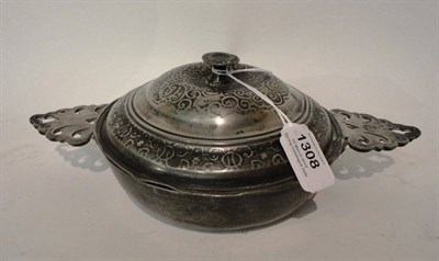 Lot 1308 - An 18th Century Pewter Ecuelle, with two pierced flat leaf shape side handles, the domed...