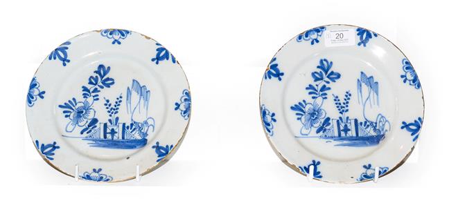 Lot 20 - A pair of 18th century English Delft blue and white pancake plates painted with chinoiserie...