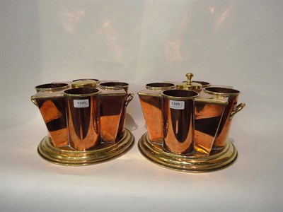 Lot 1320 - A Pair of Copper and Brass Wine Coolers, by Peak & Co, London, late 19th century, each with central