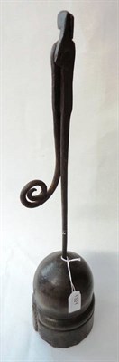 Lot 1321 - A George III Wrought Iron Rush Light Holder, with scroll terminal, on domed and turned oak...